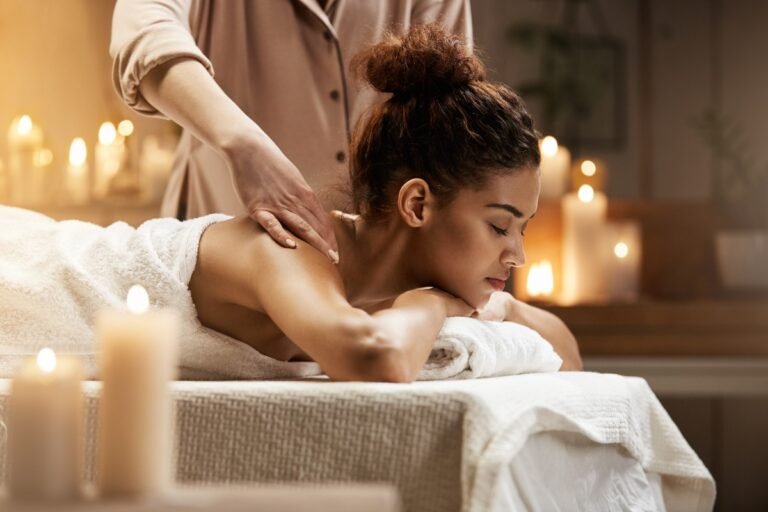 tender-african-woman-smiling-enjoying-massage-with-closed-eyes-spa-resort-1.jpg
